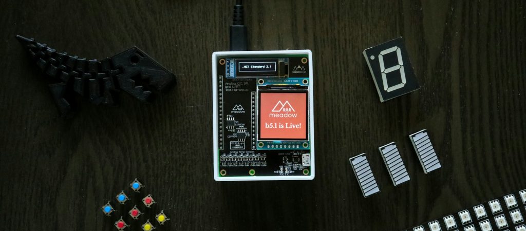 electronic components laid out on a wooden table